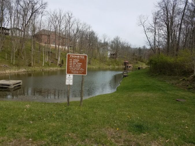 rules sign in front of the lake