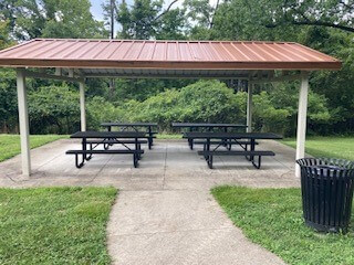 park shelter with picnic tables